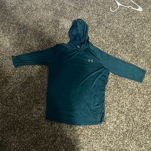 Turquoise three quarter length sleeve under armor shirt.